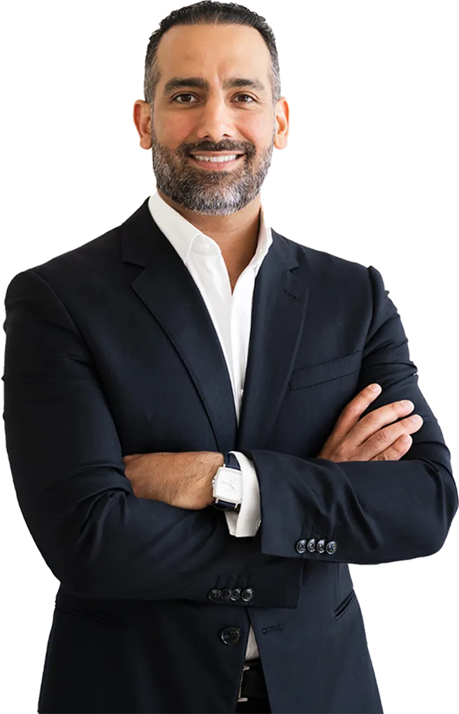Ali Nasser, keynote speaker and author, in a navy suit